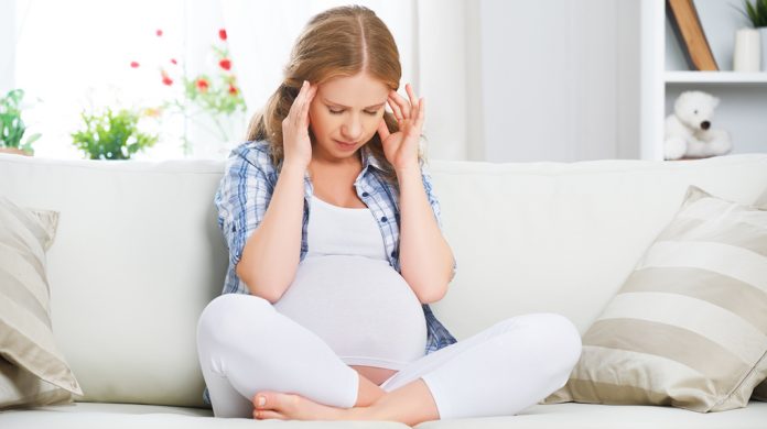 pregnant woman with headache and pain